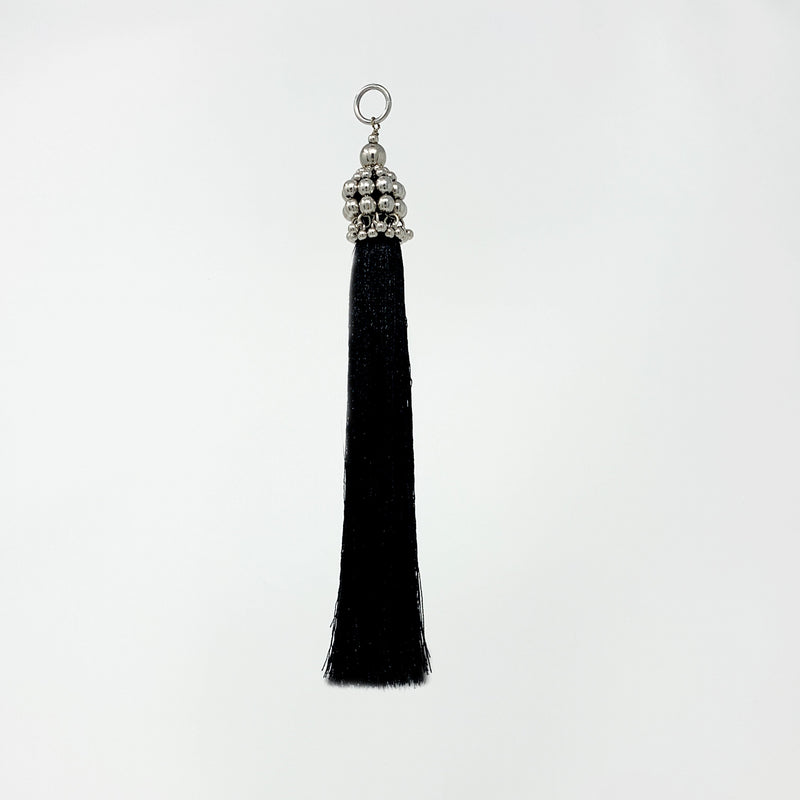Eingana Choker with Removable Tassels by Object and Dawn is constructed entirely by hand with high quality metal beads that coated in polymer to preserve shine and ensure the item is hypoallergenic.  Ethically made with secret ancient techniques by our skilled artisans.  Accented with removable black polyester tassels. Fully lined in velvet for your ultimate comfort.