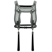 ghost image of beaded silver harness against a white background