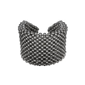 Object & Dawn beaded wrist accessory in ivory, structured supple cuff with polymer metal beads, ghost image