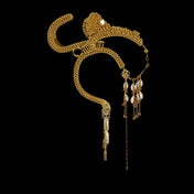 modular beaded jas headpiece system from 22 gold washed metal beads with shell beaded tassel from object and dawn in black background diagonal view