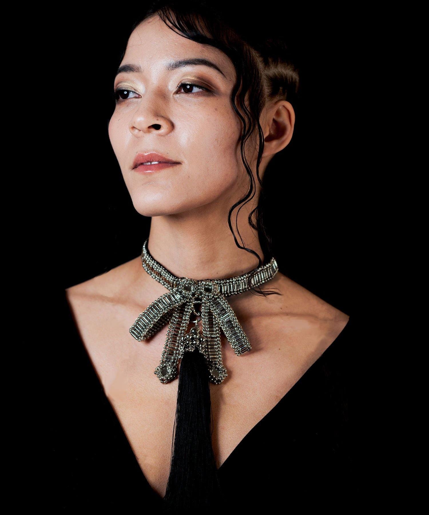 Amaya Choker by Object and Dawn is constructed entirely by hand with high quality metal beads that coated in polymer to preserve shine and ensure the item is hypoallergenic.  Ethically made by a team of our skilled in house artisans, with ancient techniques.  Fully lined in velvet for your ultimate comfort.