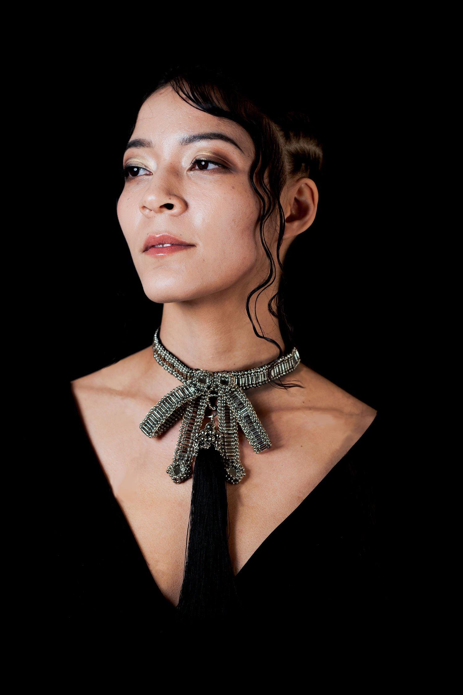 Amaya Choker by Object and Dawn is constructed entirely by hand with high quality metal beads that coated in polymer to preserve shine and ensure the item is hypoallergenic.  Ethically made by a team of our skilled in house artisans, with ancient techniques.  Fully lined in velvet for your ultimate comfort.