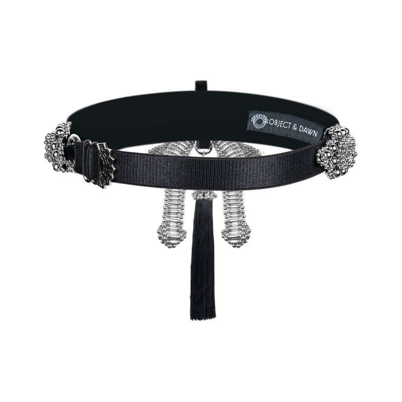 Amaya Garter Band by Object and Dawn. Power is sexy. You'll feel both wearing this one.   Our skilled artisans use an ancient and disappearing technique to construct your piece. Made with high quality metal beads that are coated in polymer to preserve shine and ensure the item is hypoallergenic. The garter band is fully lined by hand in luxurious velvet and has an adjustable elastic strap to comfortably fit to your thigh circumference.